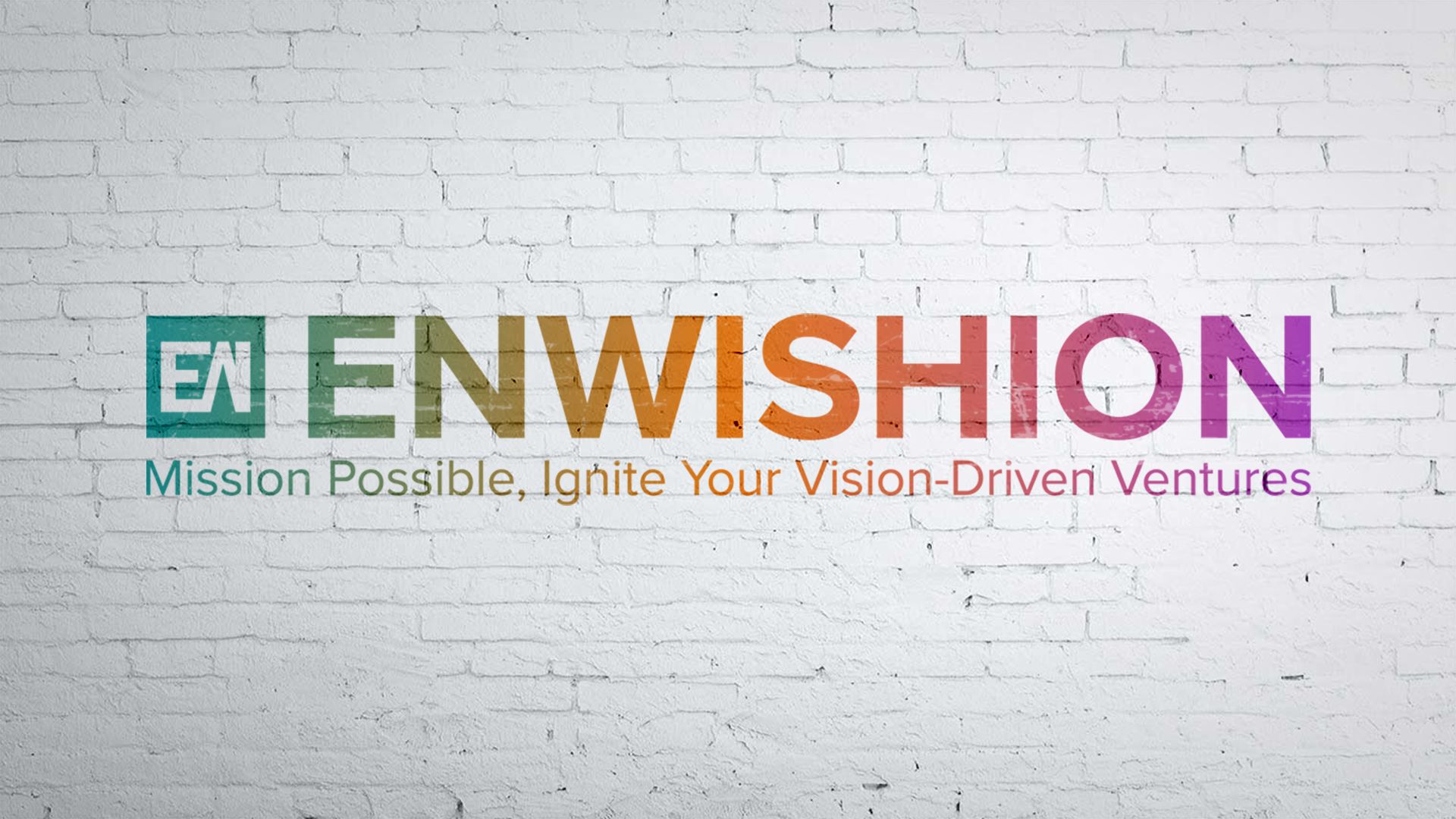 The Enwishion logo on a white brick wall.