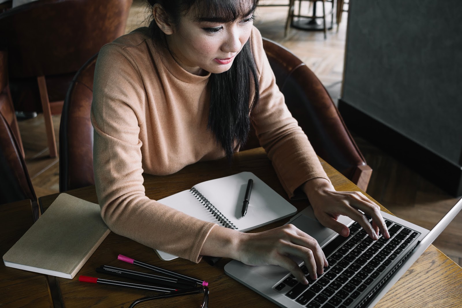 Woman using a laptop to do research