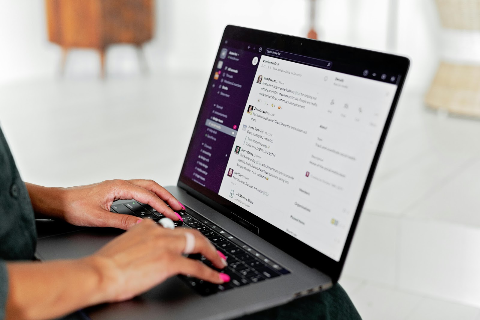 Person using Slack Groups on laptop