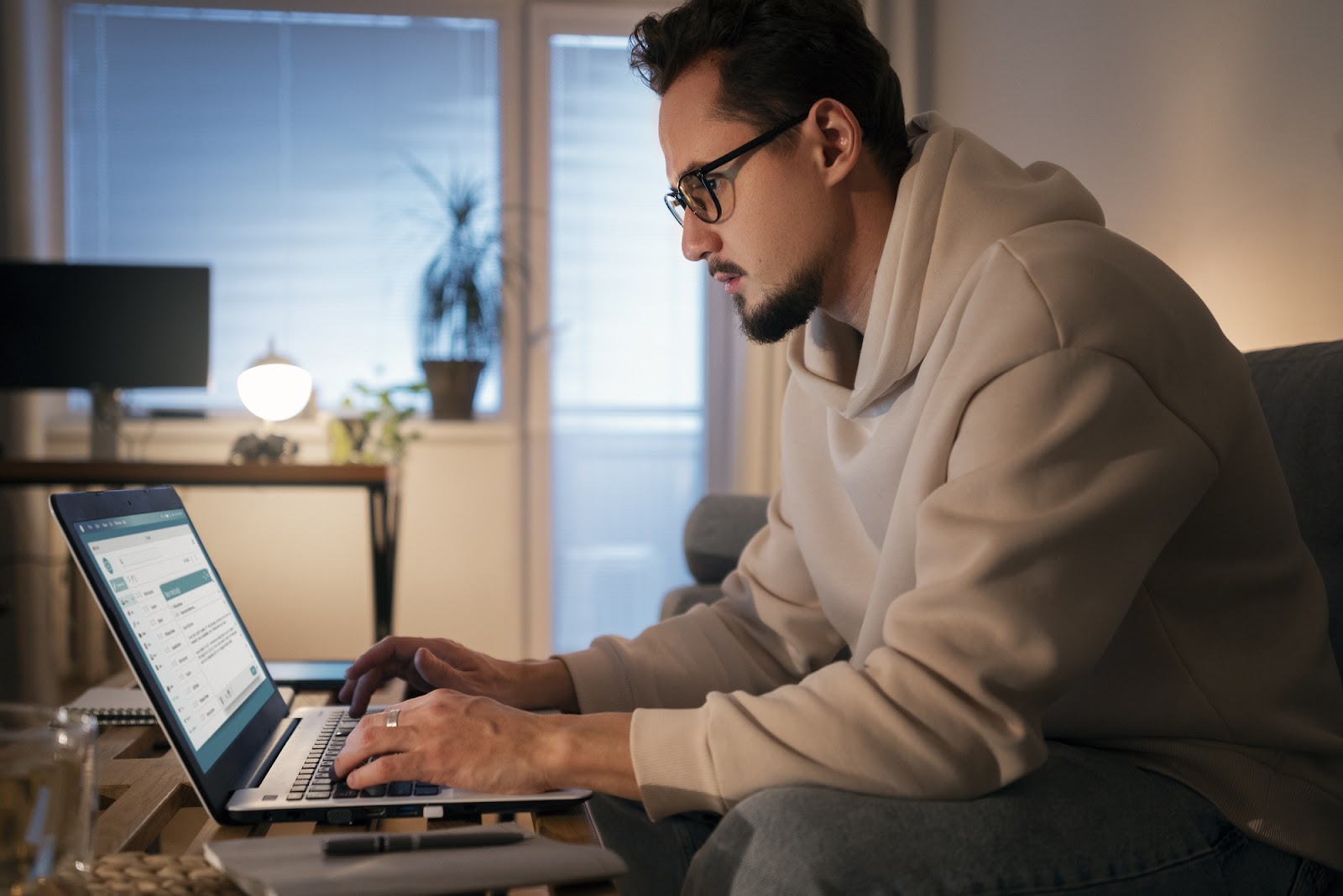 Man using a laptop to send emails