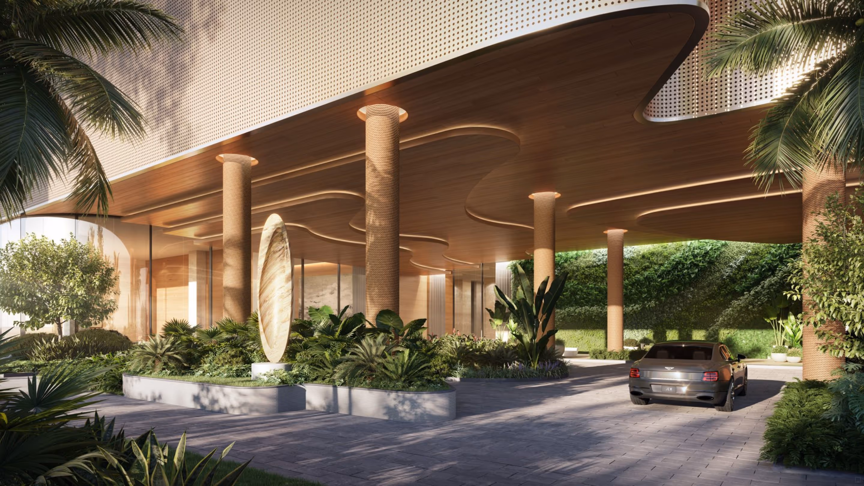 Covered porte-cochere leading to the lushly landscaped lobby driveway