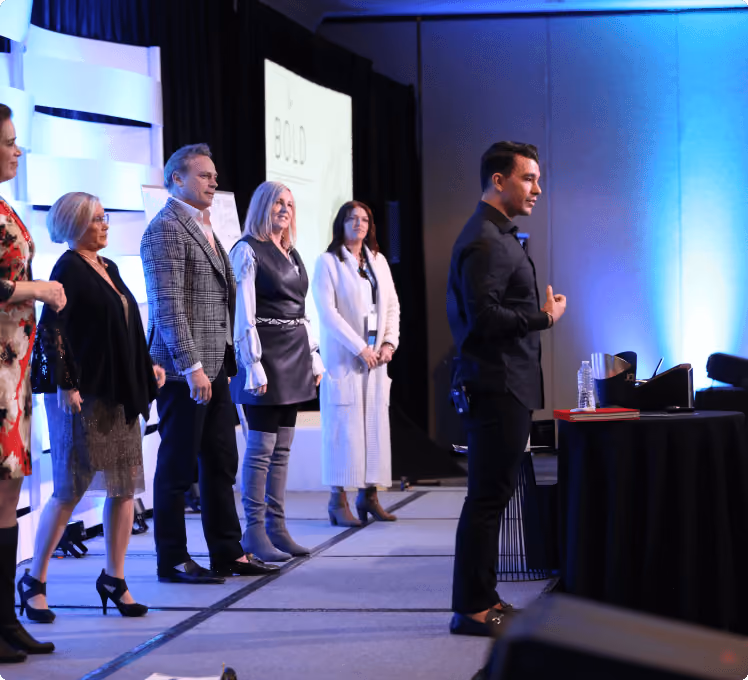 A team of professionals standing on a stage, ready to deliver a powerful presentation.