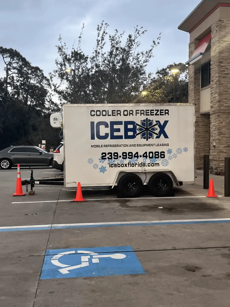 A icebox truck parked in a parking lot