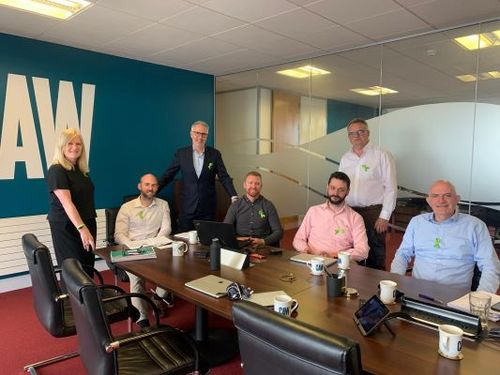 CAW Management Team wearing green ribbons to reduce stigma around mental health