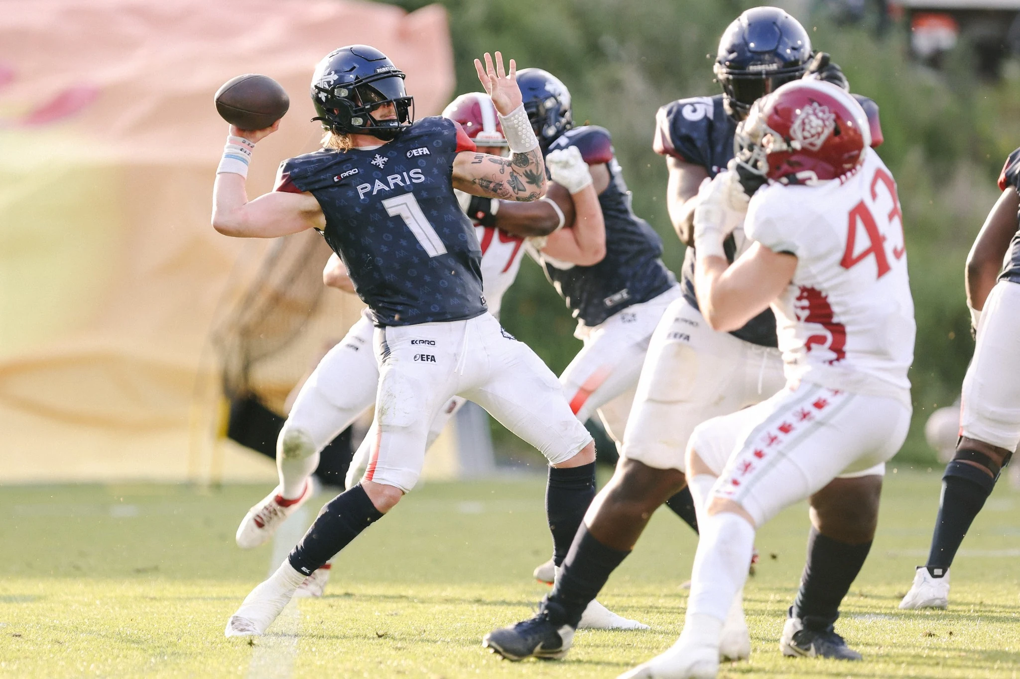 Paris Musketeers quarterback throws a pass against the Prague Lions.