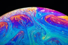 Paint-covered ball rolling across the surface