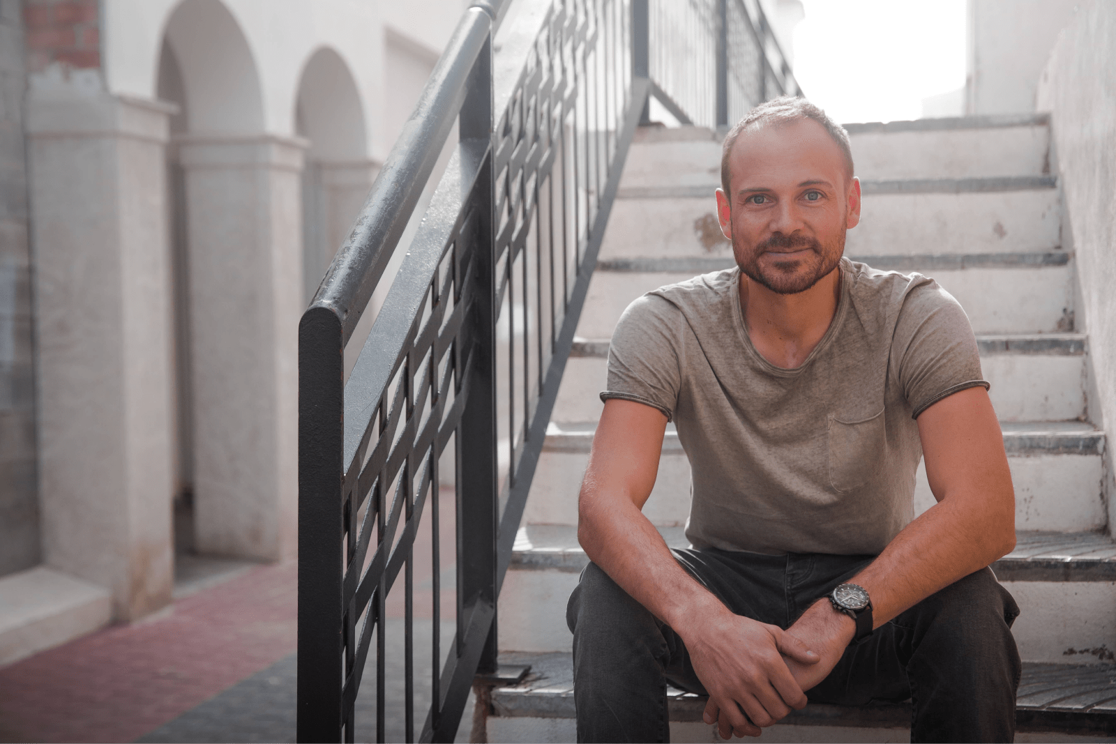 Sam Hardwick sitting outdoors
