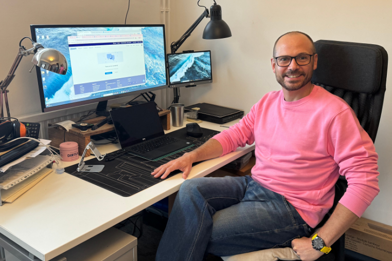 Sam Hardwick sitting at his desk