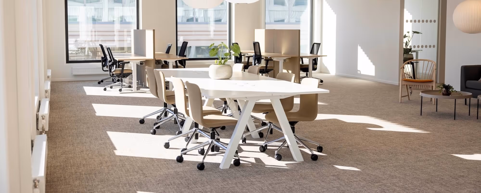 WELL and BREEAM certified office with ergonomic workstations acoustic booths and sustainably sourced furniture contributing to certification credits