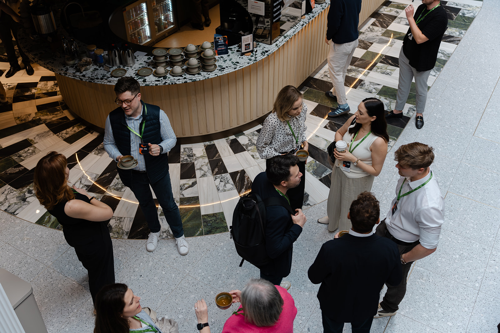 Overhead networking shot Attendees networking over coffee at the Why Members Stay event hosted by NORNORM and TechnologyWithin at Uncommon, Holborn.