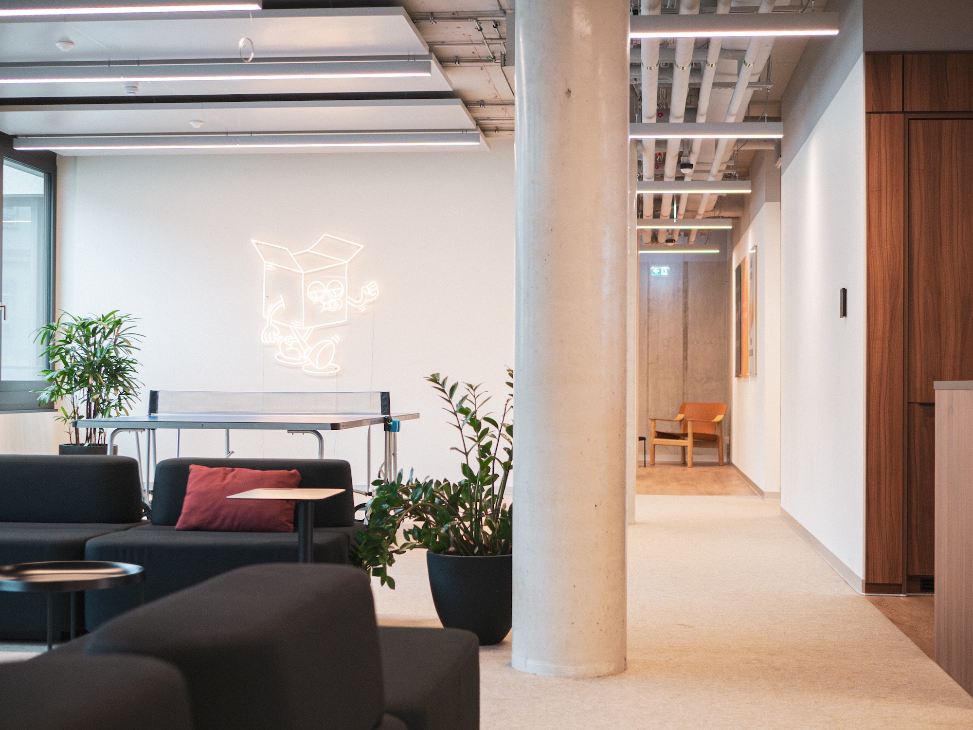 Lounge and games area in Hive's Berlin office with NORNORM seating and a table tennis table