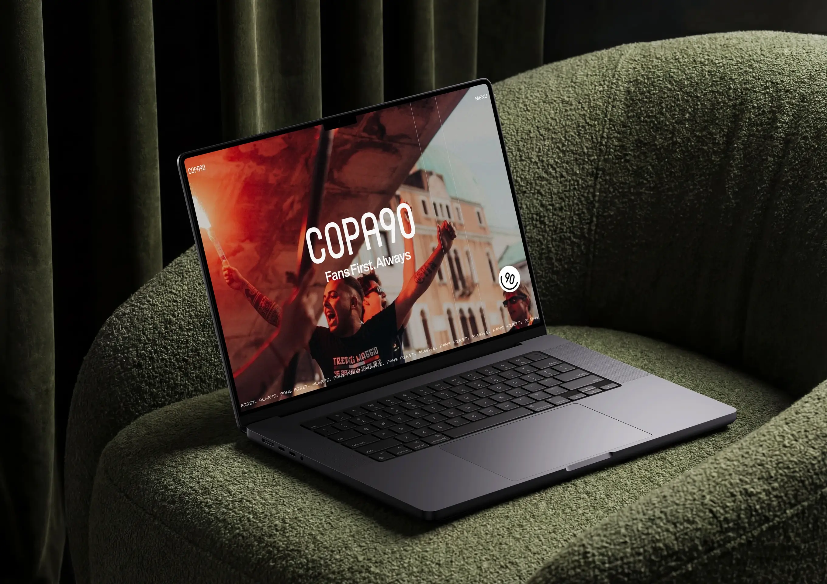 Copa90 website homepage hero section on a laptop mockup, showing the 'Fans First. Always' tagline over a football fan crowd image, designed and built by Code & Wander