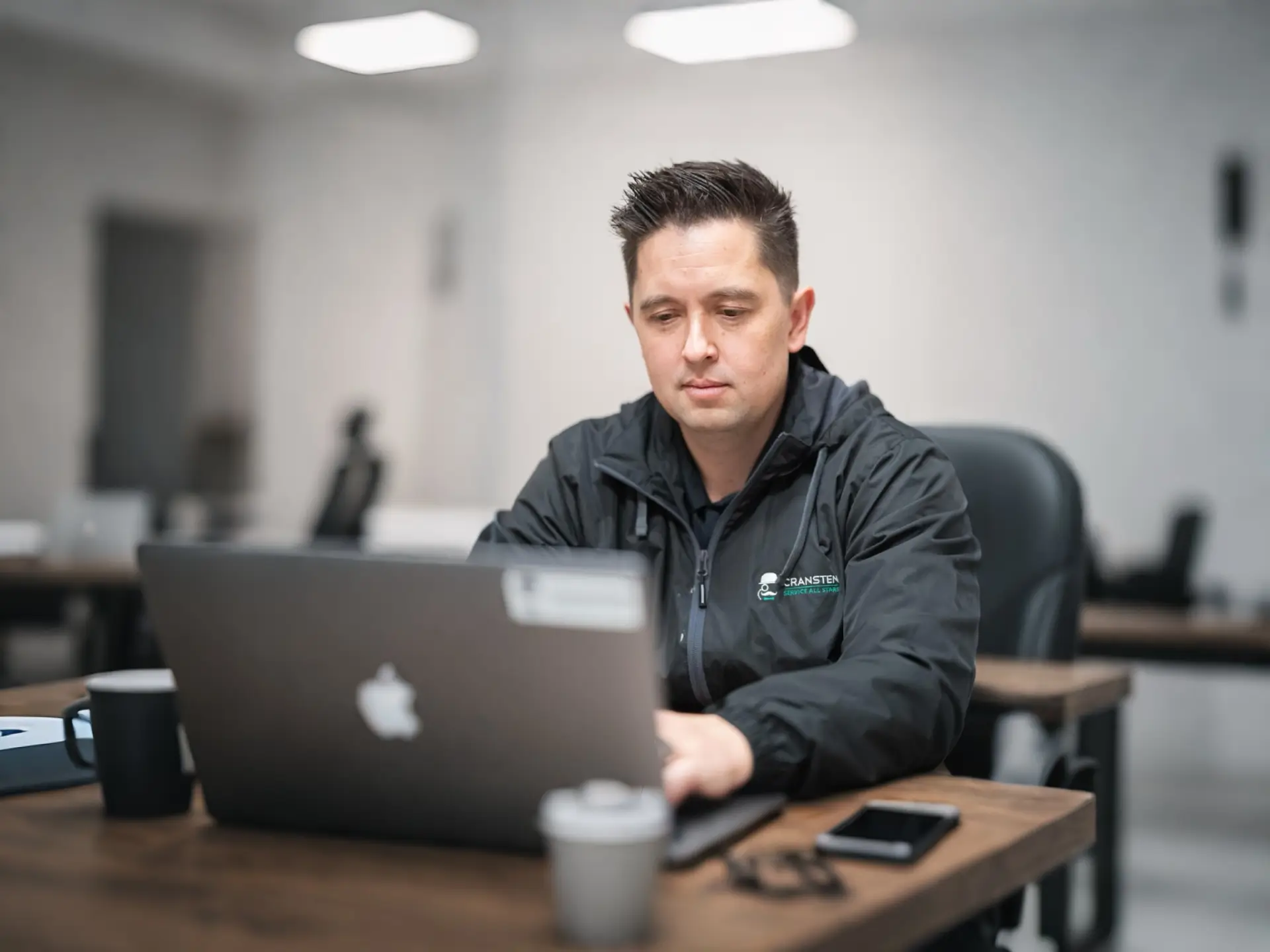 Trevor Maddux working in the office