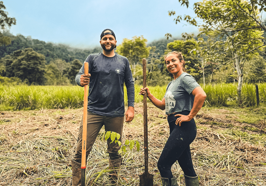People in front of a recently planted tree