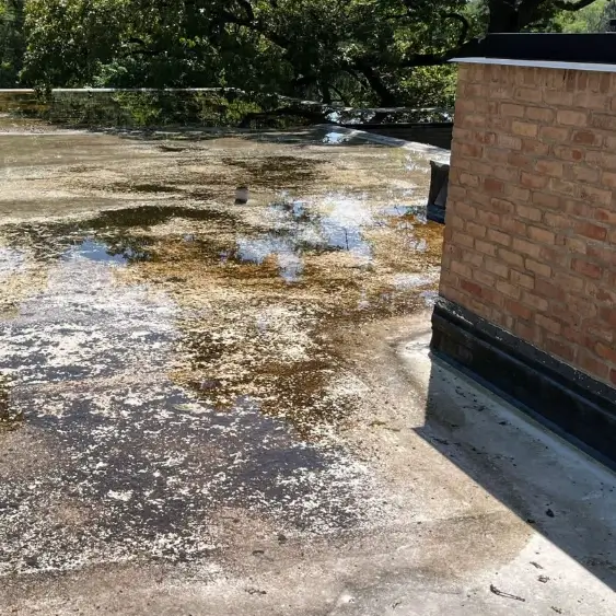 a grimy commercial roof before pressure washing