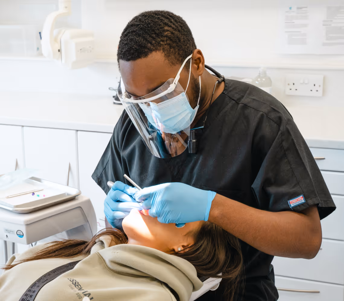 Dentist treating patient in dental chair