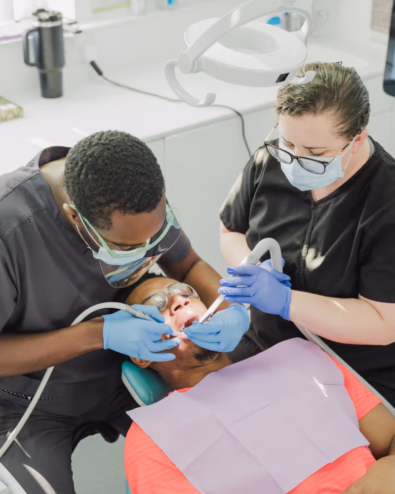 Dental treatment with dentist and nurse