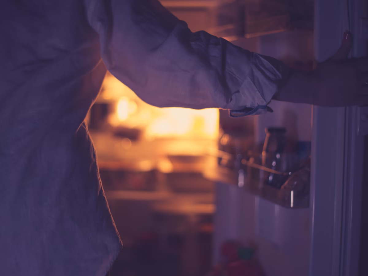 teen opening refrigerator 