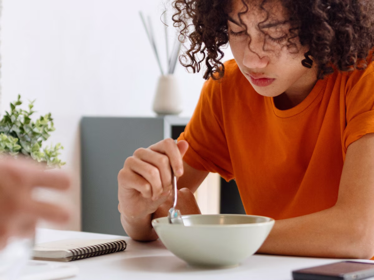 woman eating from bowl