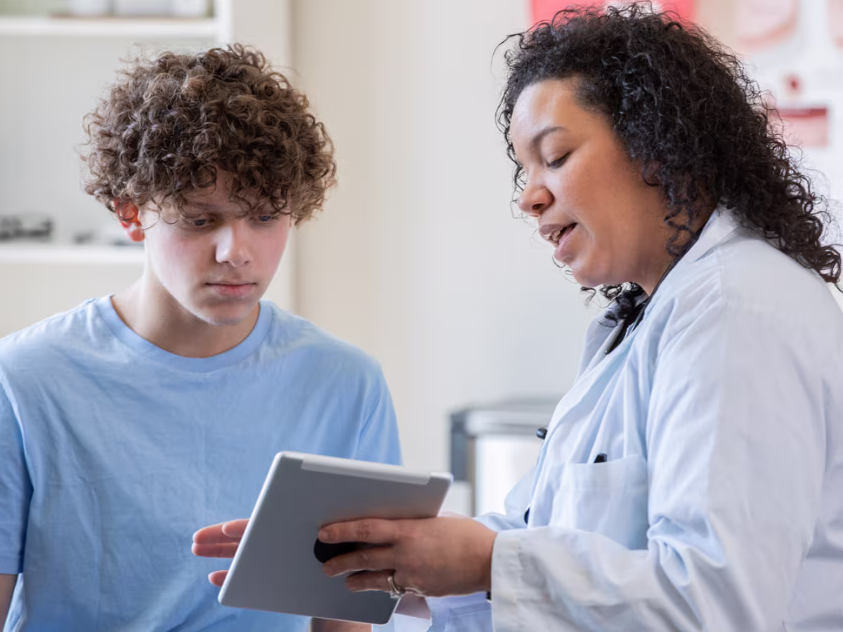 doctor speaking with teen