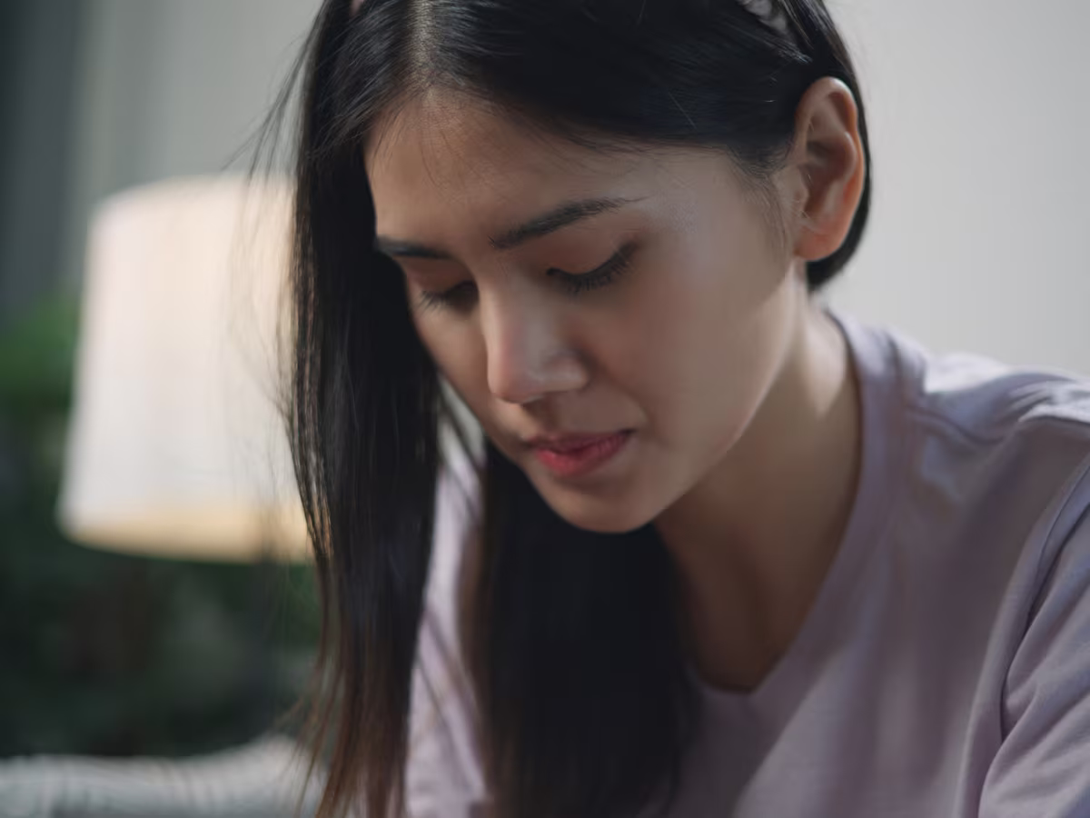 woman looking down sad