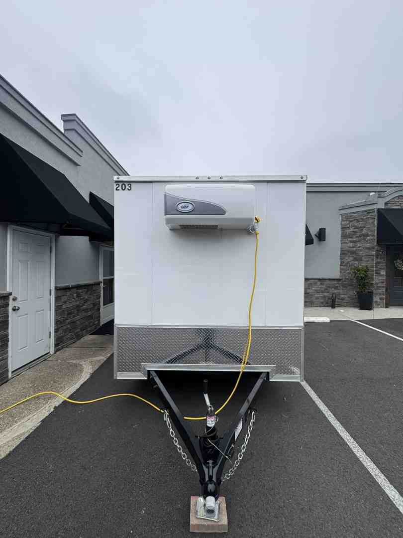 Close-up of a trailer control panel showing 110V digital thermostat and power settings - 110V refrigeration unit Close-up of a trailer control panel showing 110V digital thermostat and power settings - 110V refrigeration unit