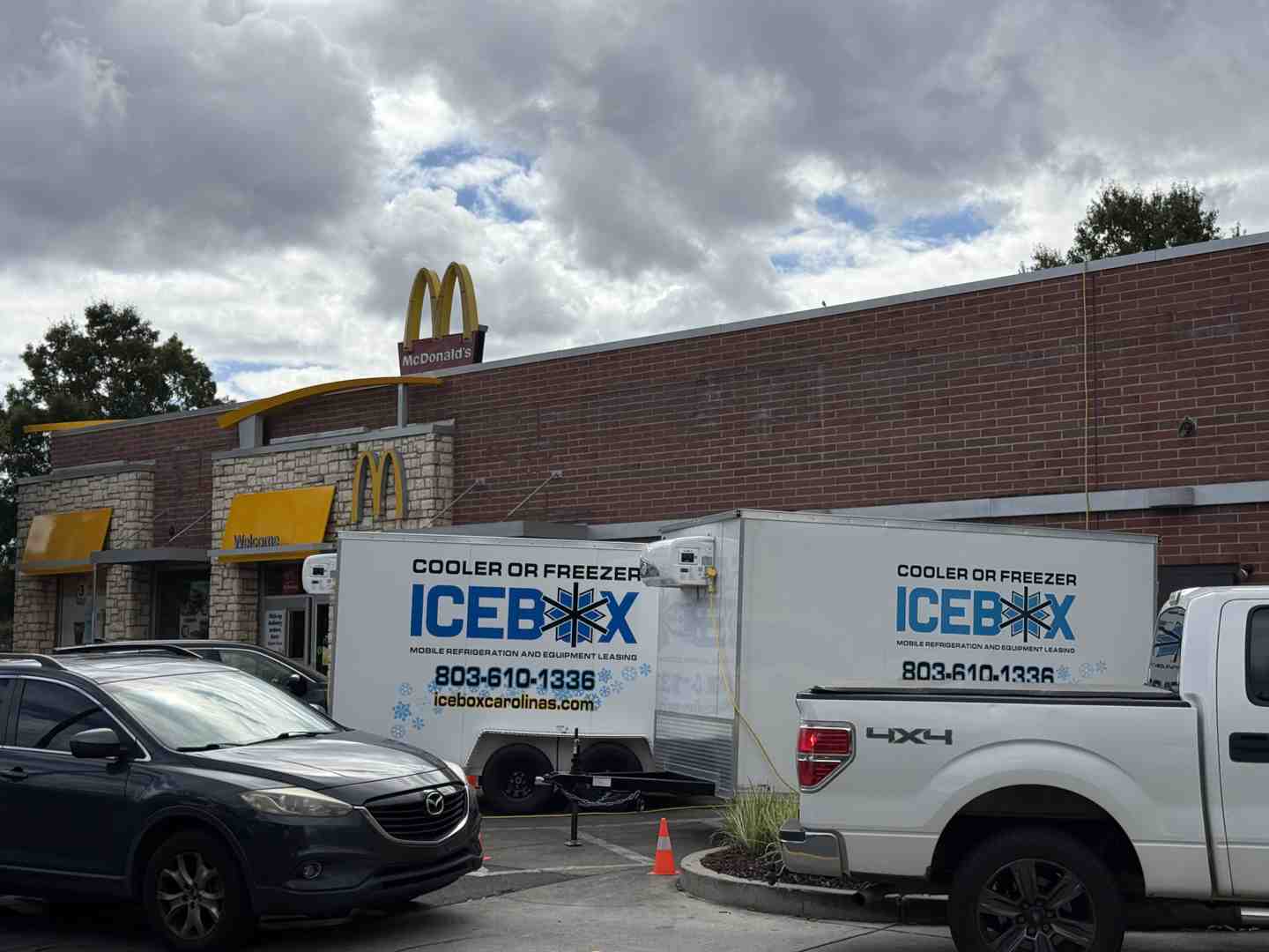 Mobile freezer trailer parked behind a restaurant during a renovation - walk-in freezer services Mobile freezer trailer parked behind a restaurant during a renovation - walk-in freezer services