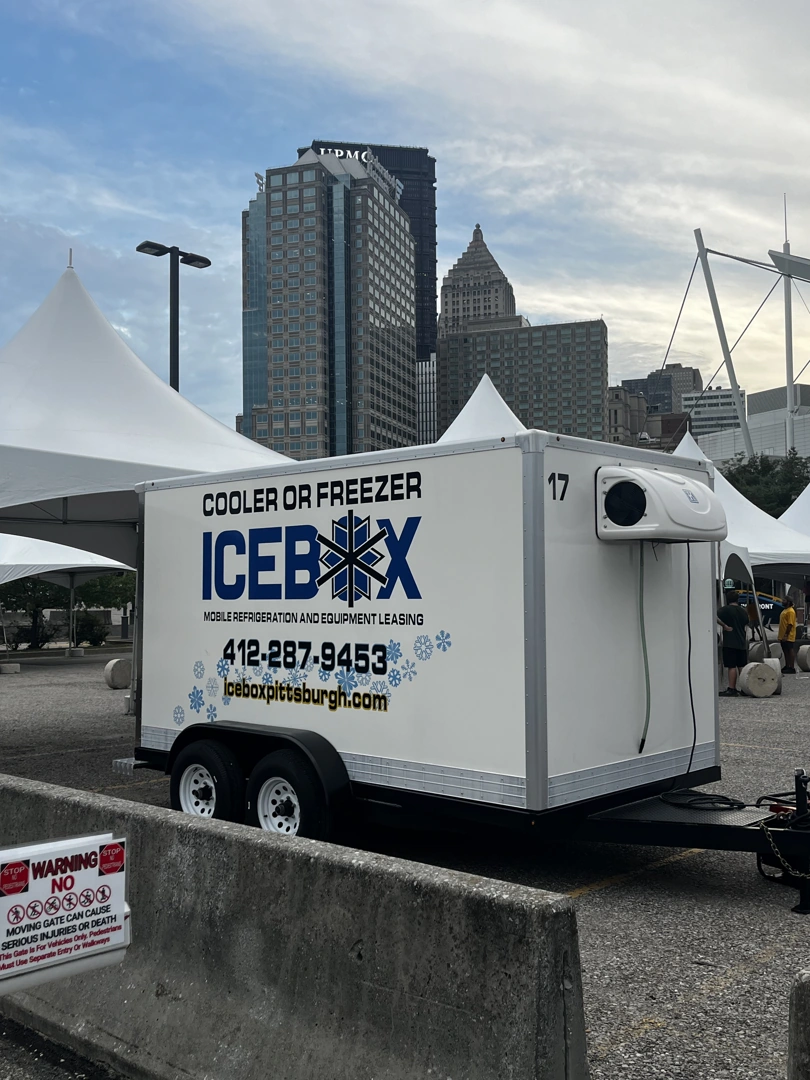 a 16-foot mobile freezer trailer parked at an outdoor event venue