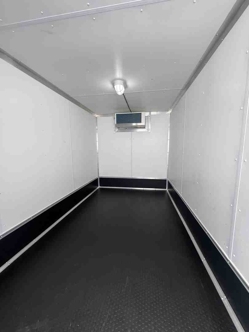 Trailer with wide pallet door open showing interior shelving - rent walk in cooler Trailer with wide pallet door open showing interior shelving - rent walk in cooler