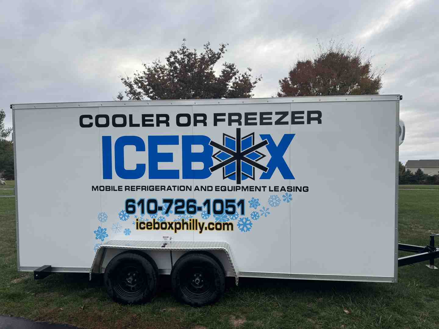 clean, modern walk-in mobile freezer trailer parked on-site at a restaurant