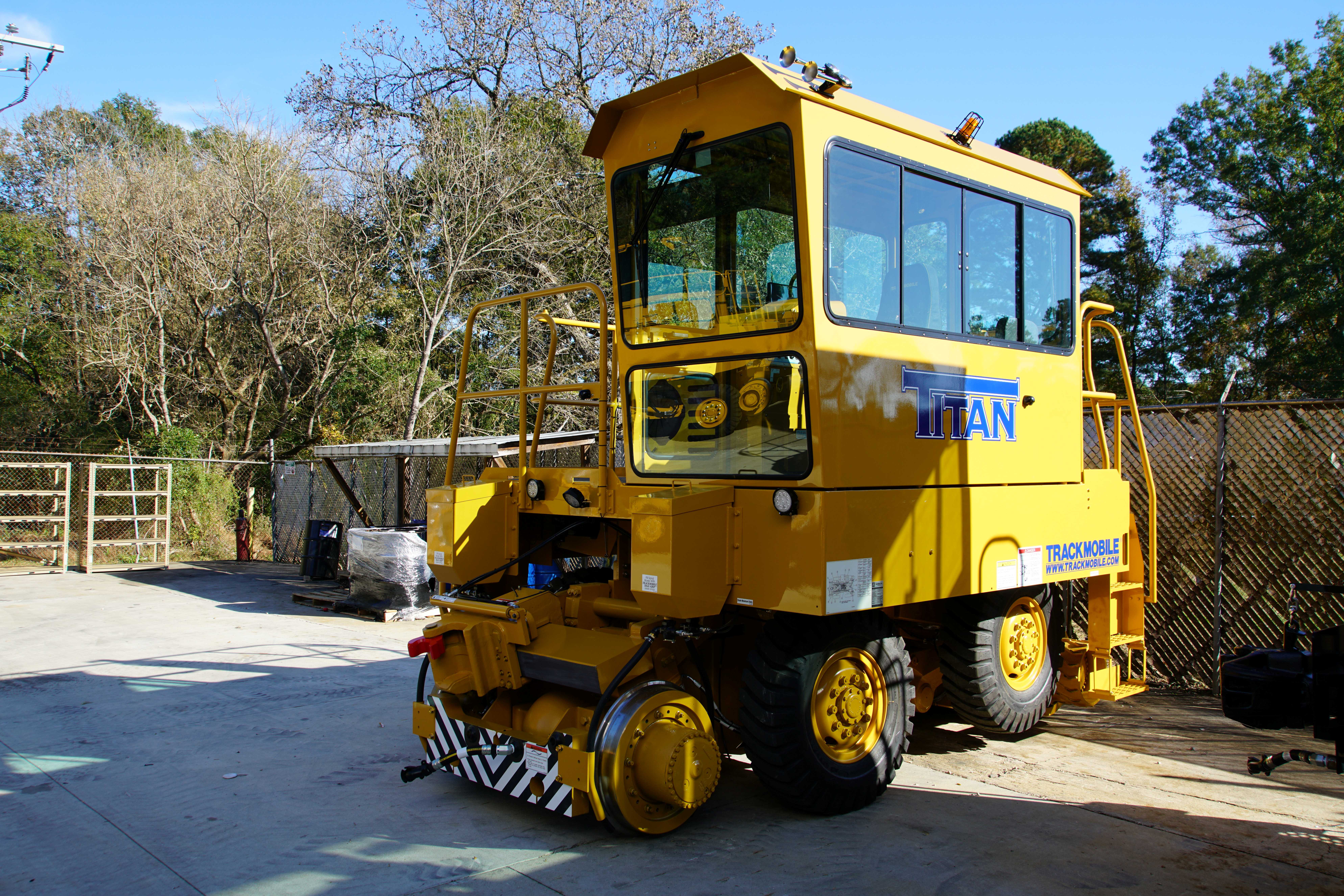 Titan 98762 unit photographed near a fence, on cement