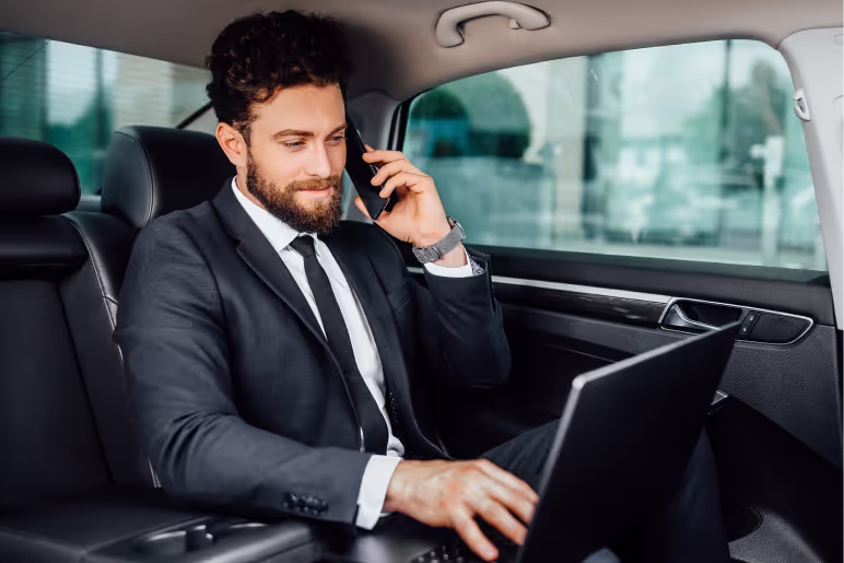Businessman on phone in car