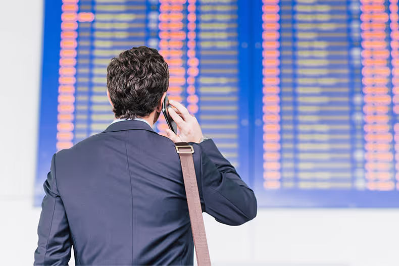 Man looking at flight schedule