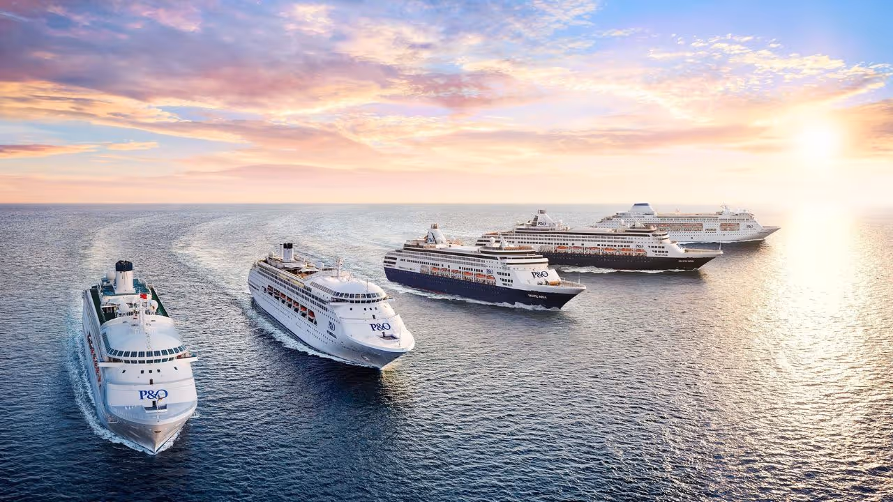 Four P&O cruise ships sailing in line on calm ocean waters at sunset.