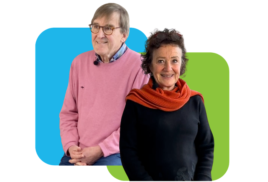 A young black man clapping the hand of an older lady with a tanned complexion while smiling