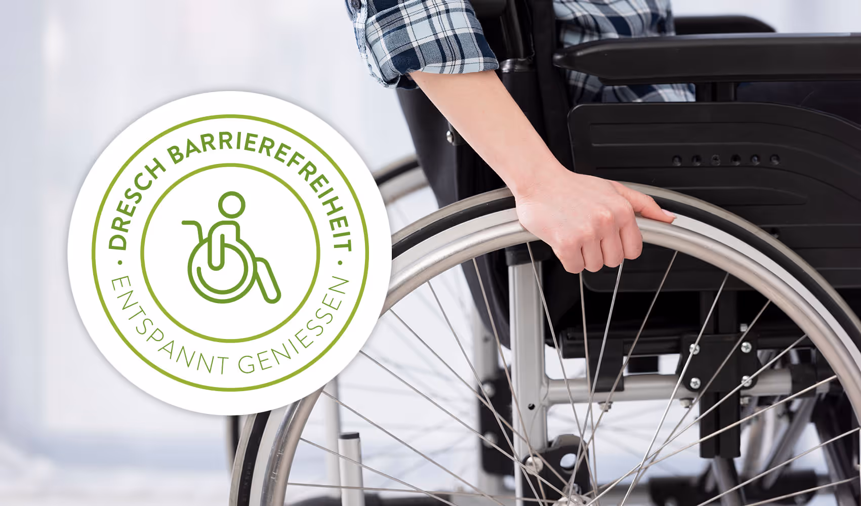 Dresch Barrierefreiheit Siegel. Mann im Rollstuhl.