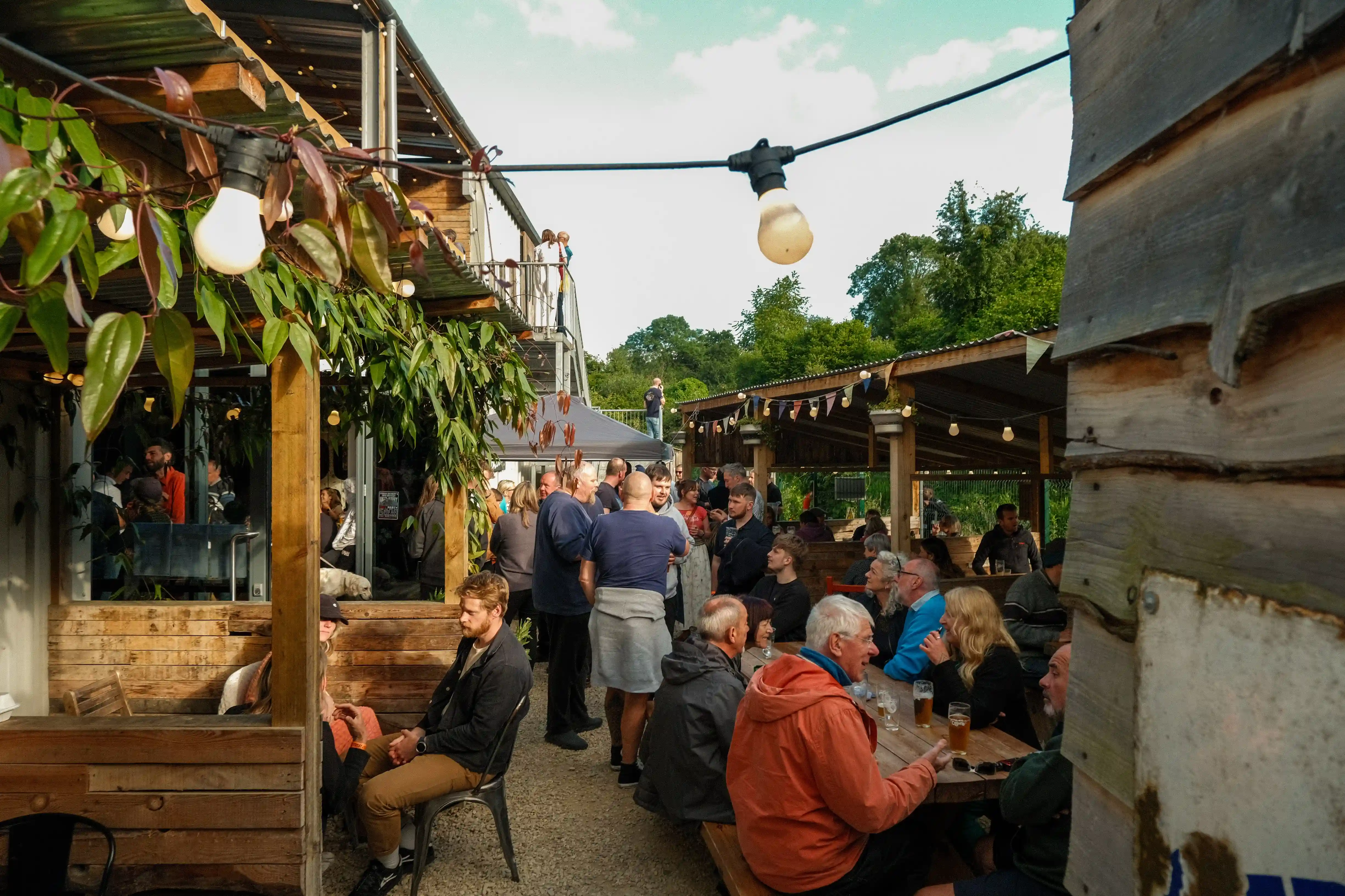 Stroud Brewery's garden with customers sitting and chatting