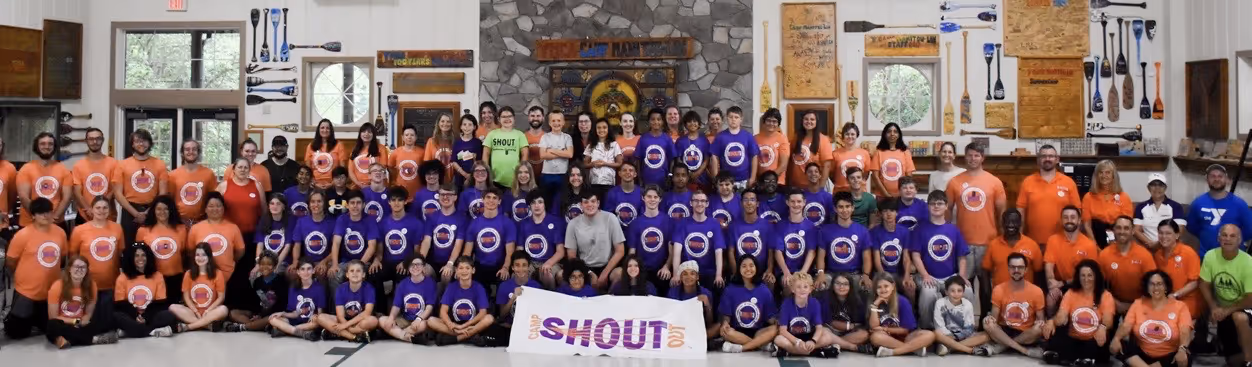 A group of people posing for a photoDescription automatically generated