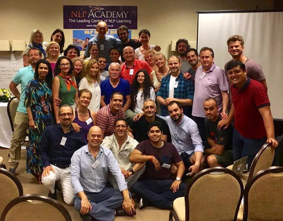 Abhay Thhakkar with John Grinder and group at NLP training