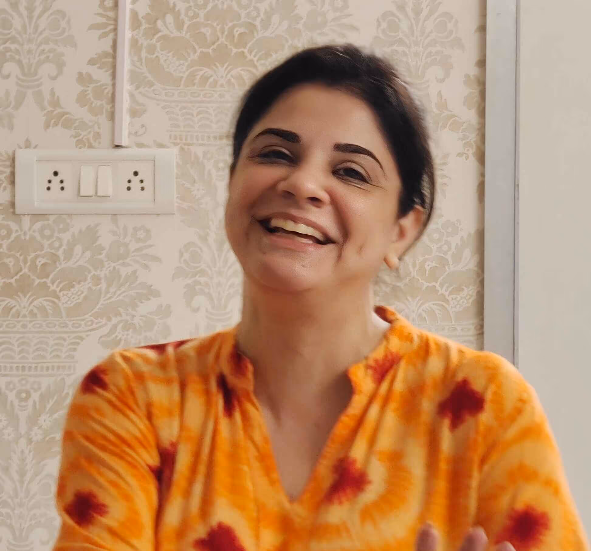 a lady smiling during NLP training in India