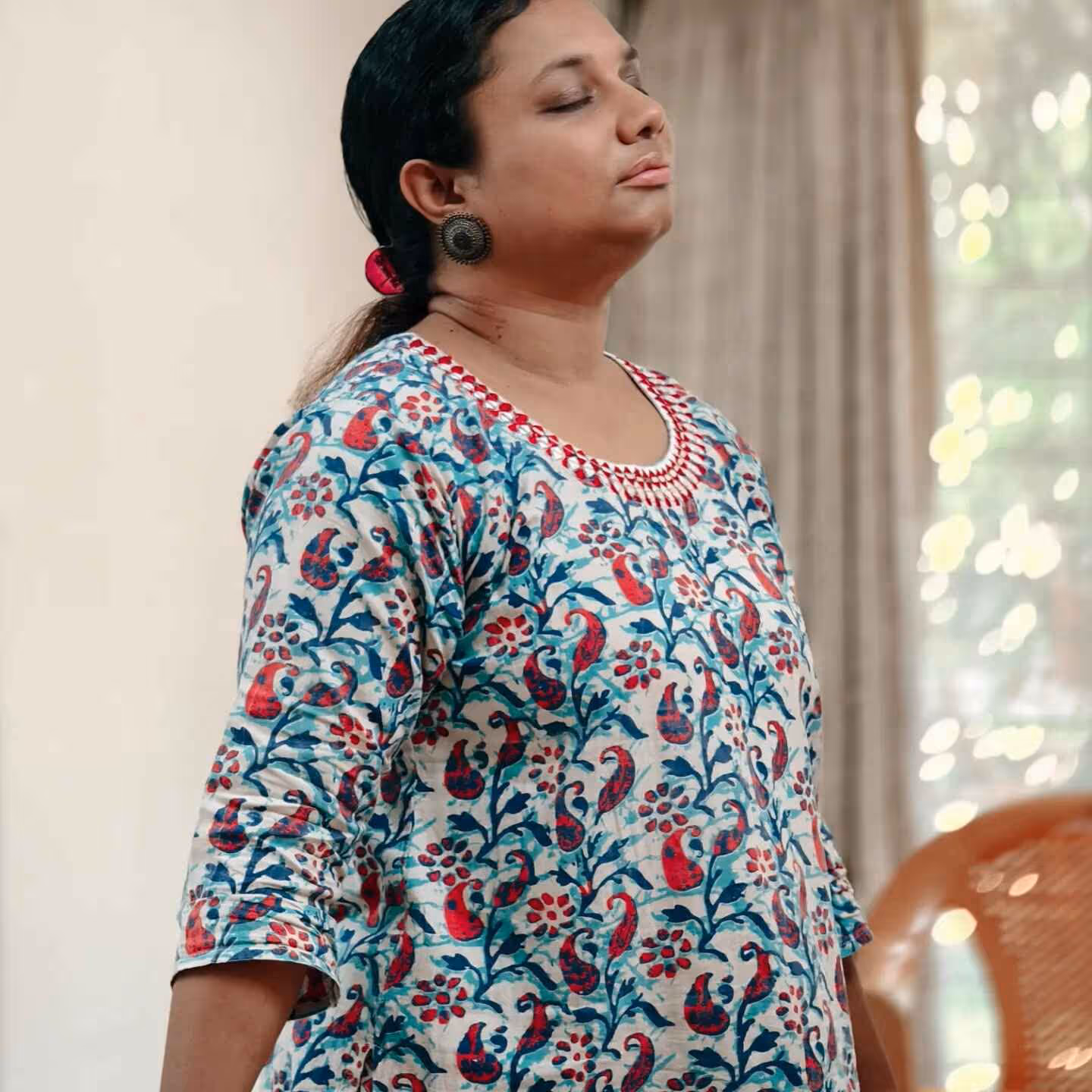 a lady with hands stretched out during Abhay's NLP Training