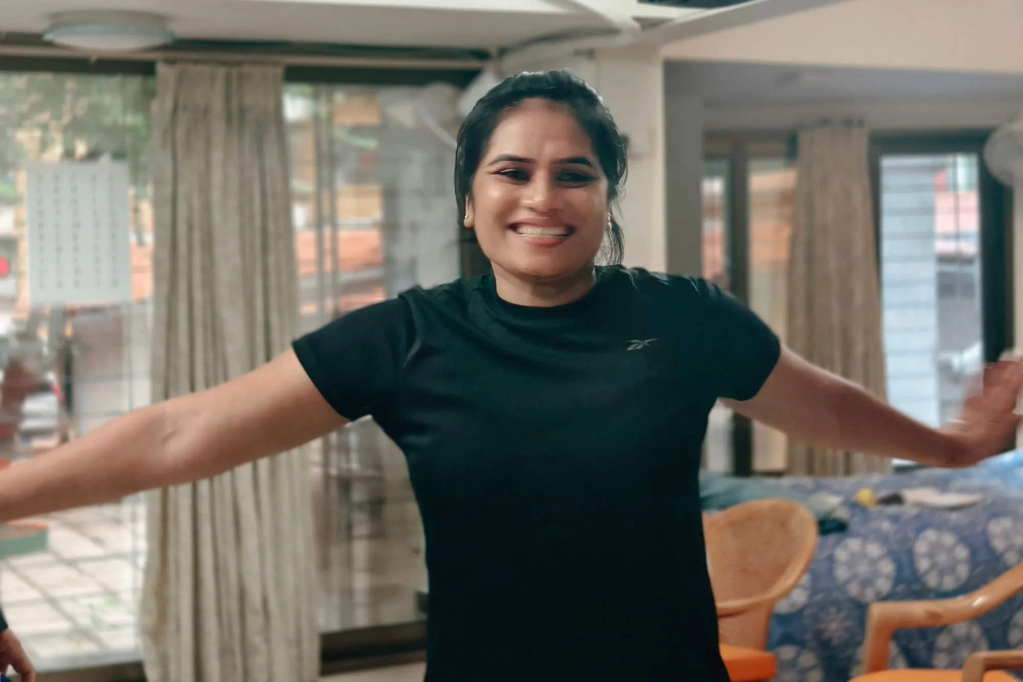 a lady smiling during NLP training course in India