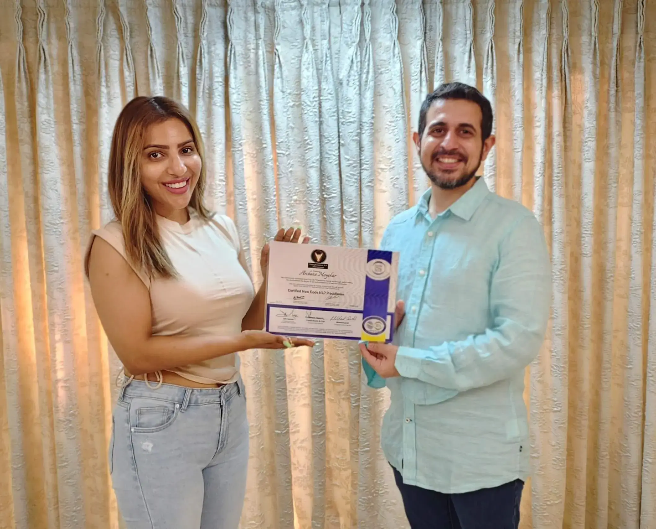 Abhay Thakkar presenting the NLP Practitioner certificate to a participant - Archana, after completing the Internationally Certified New Code NLP Course in Mumbai, India