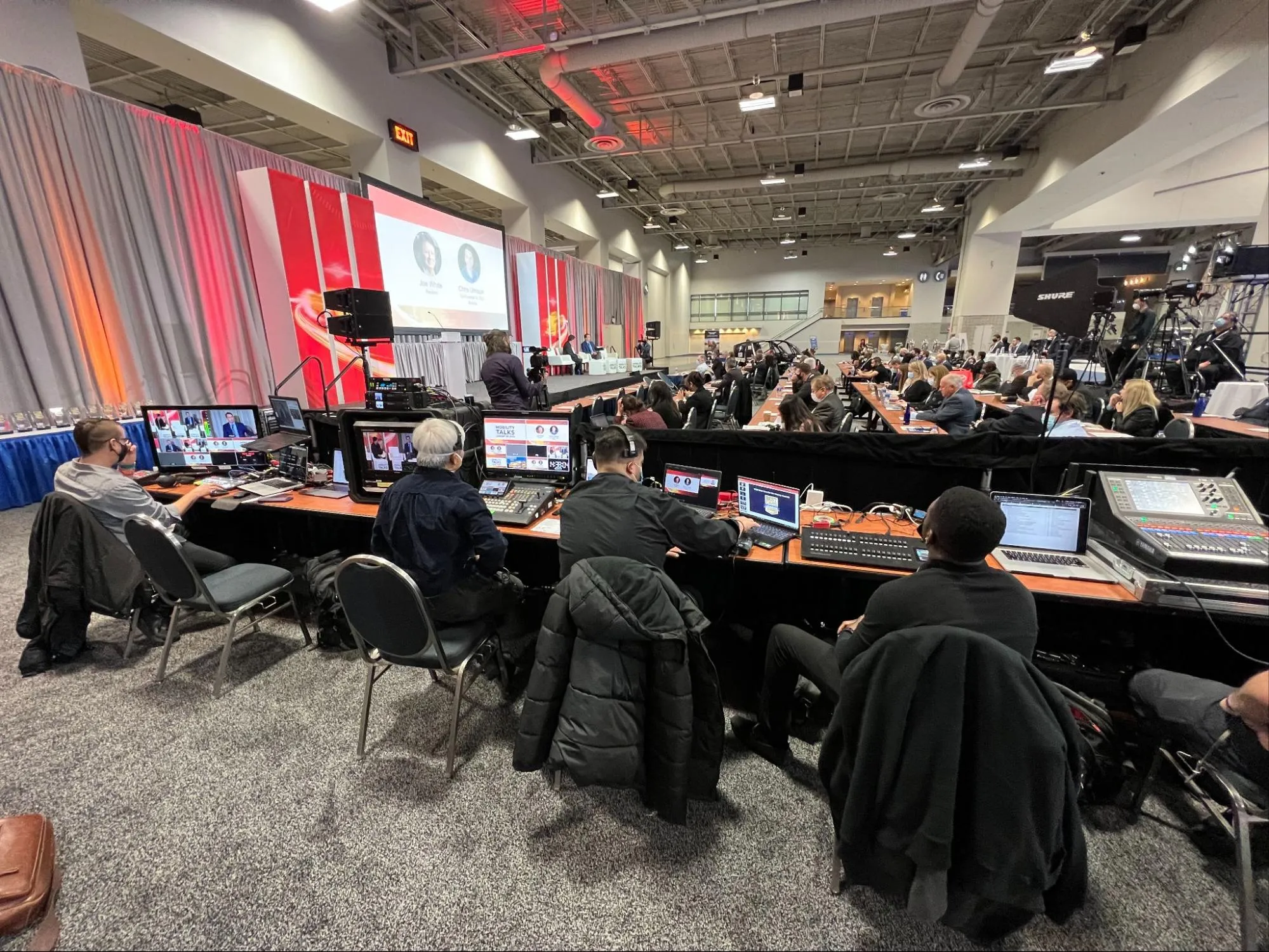 Group of people sitting at a control center