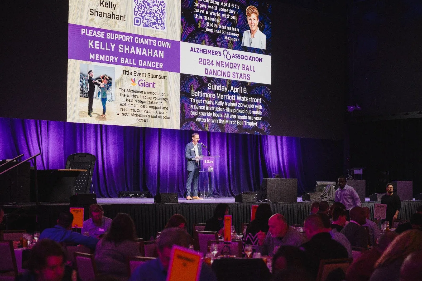 Picture of a presenter on stage