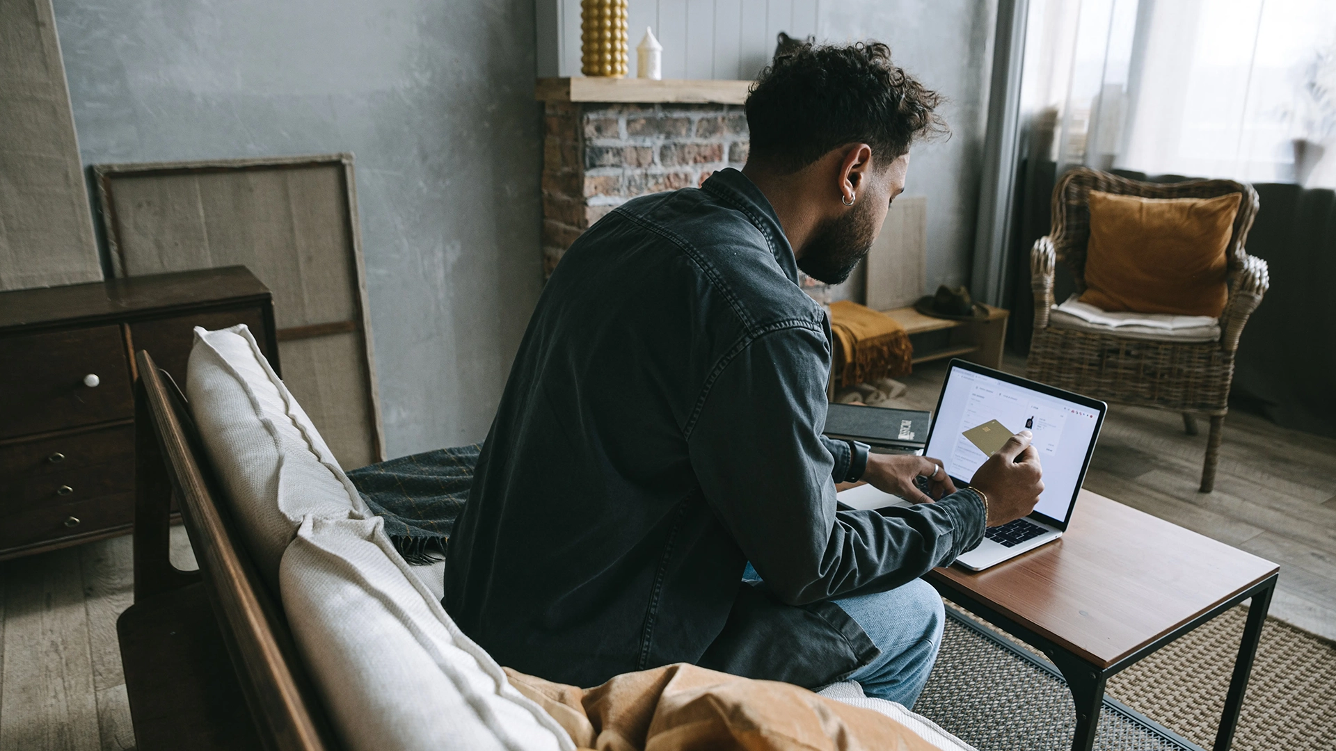 A black man entering his credit card details to give through Overflow's giving platform