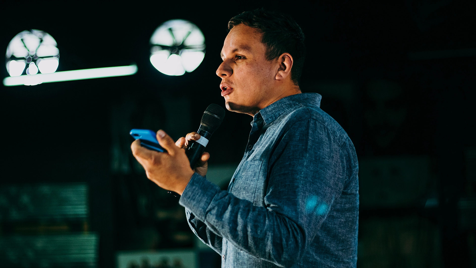 young pastor speaking to his church about Overflow