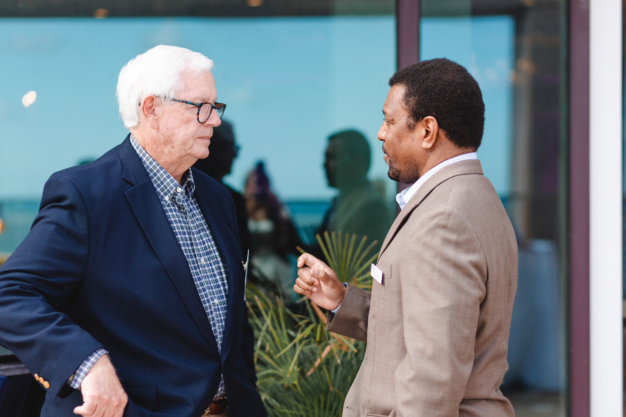 two men speaking together