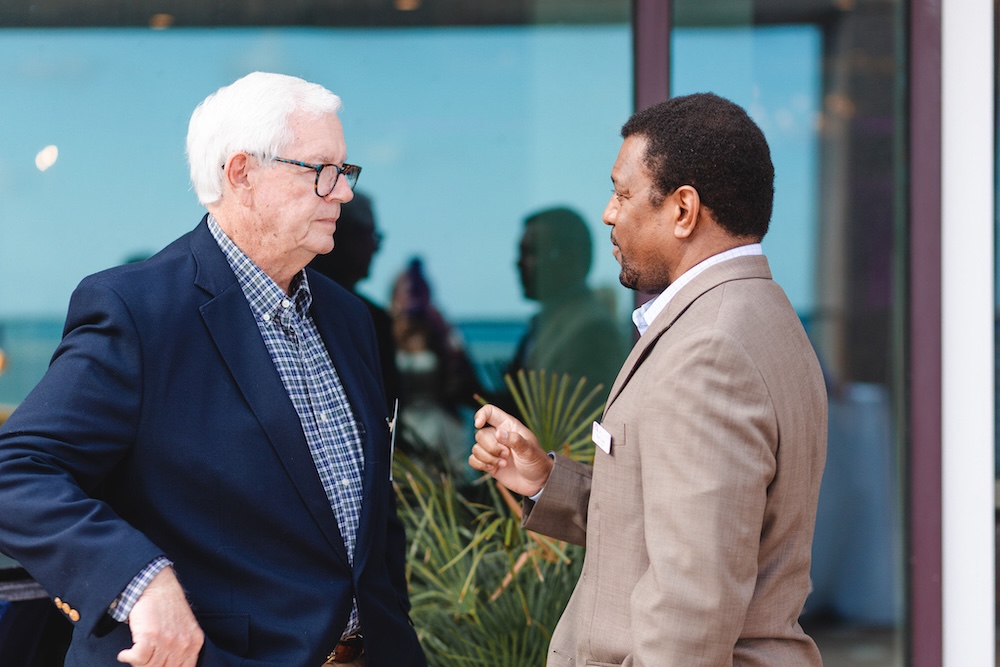 two men speaking together