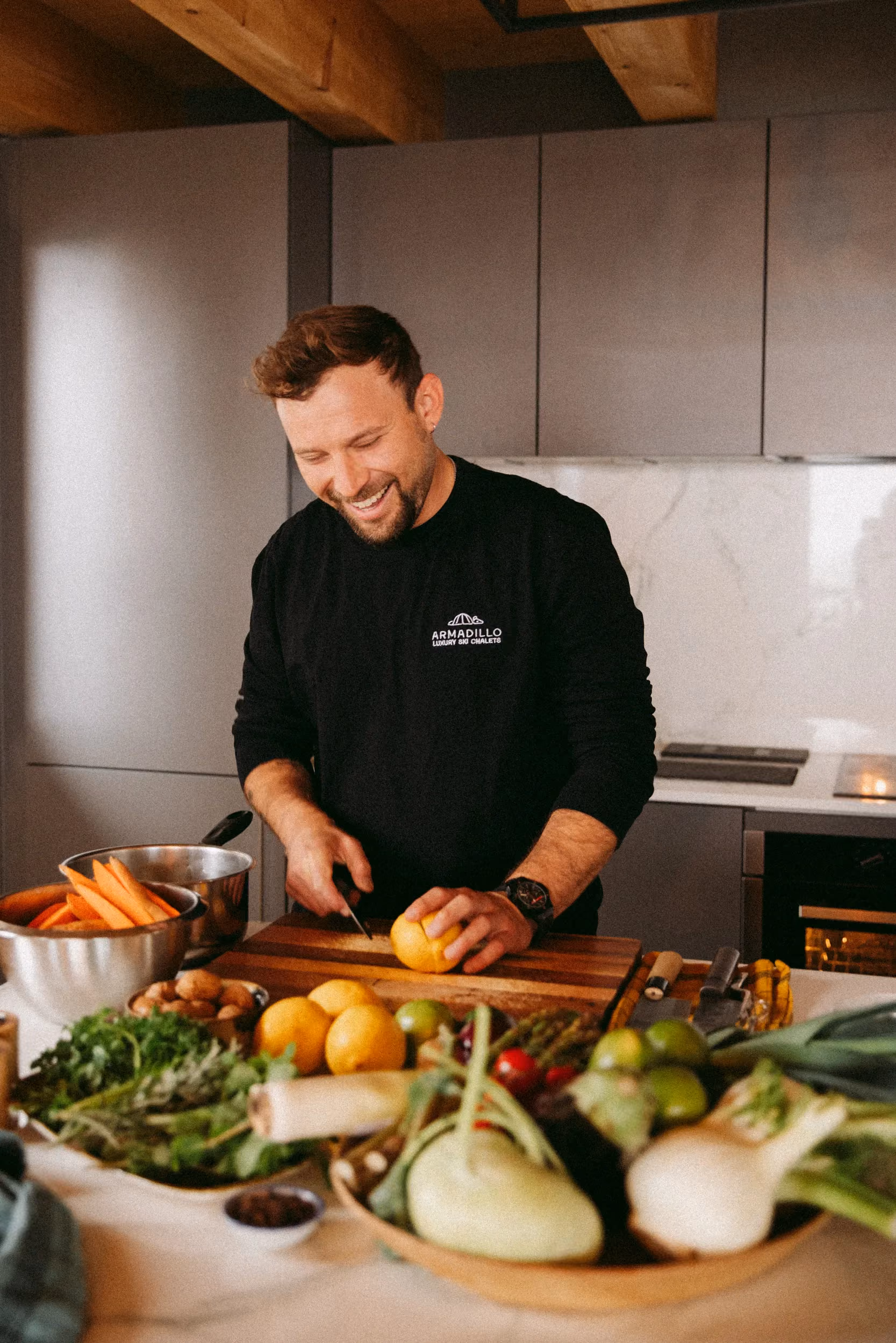 An Armadillo private chef prepares fresh ingredients in a luxury ski chalet kitchen